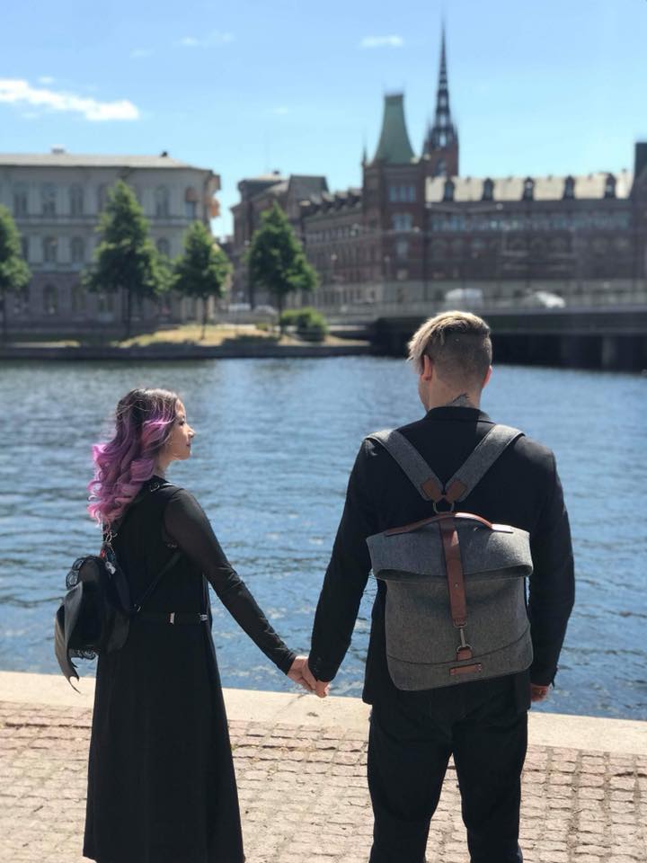 Chris and his partner by a canal in Stockholm